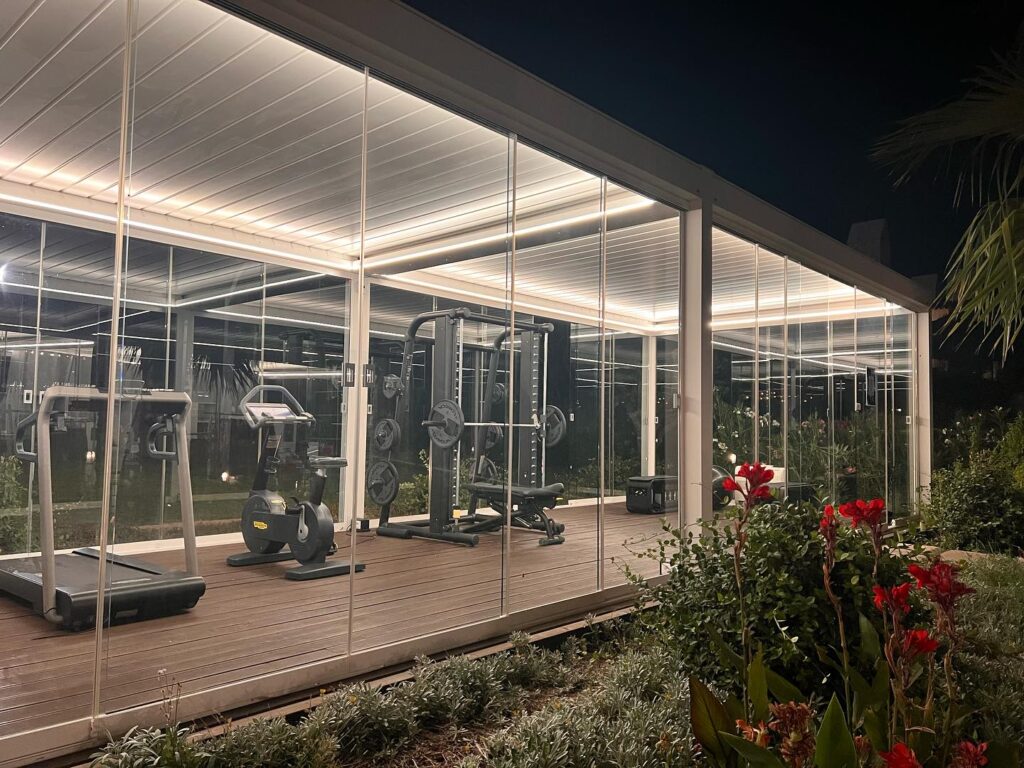 Smart Pergola Features That Actually Matter 5 Frameless glass door