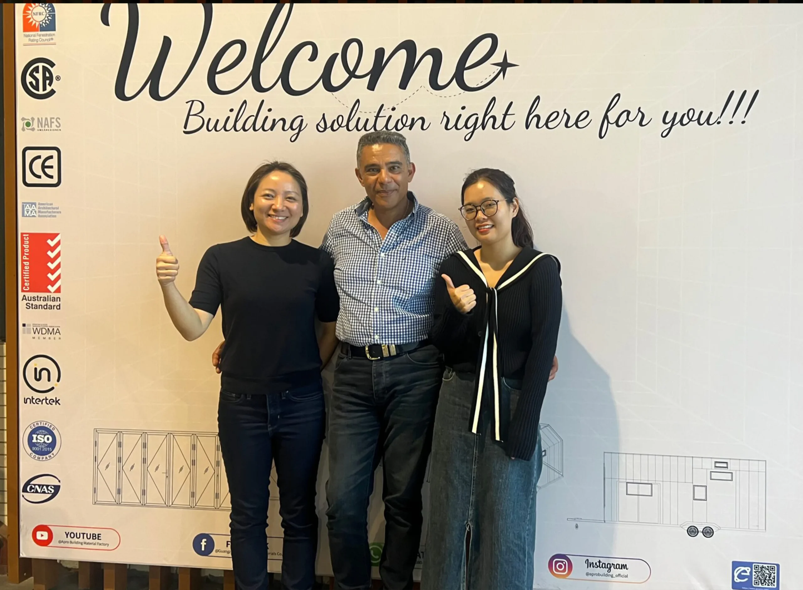 Progolas & Aprodoor and its customers take a photo in front of the company's billboard