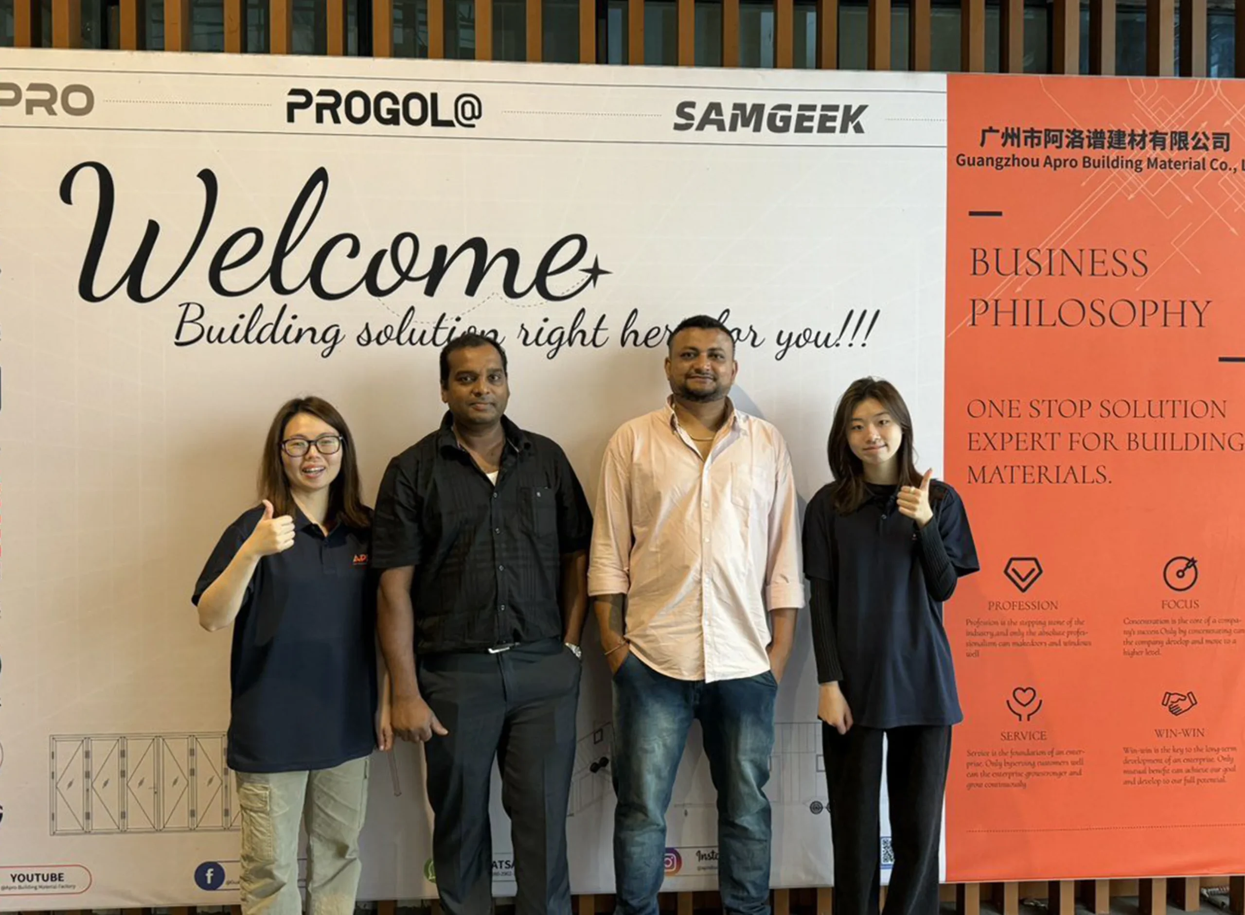 Progolas & Aprodoor and two foreign clients took a photo in front of the company's billboard