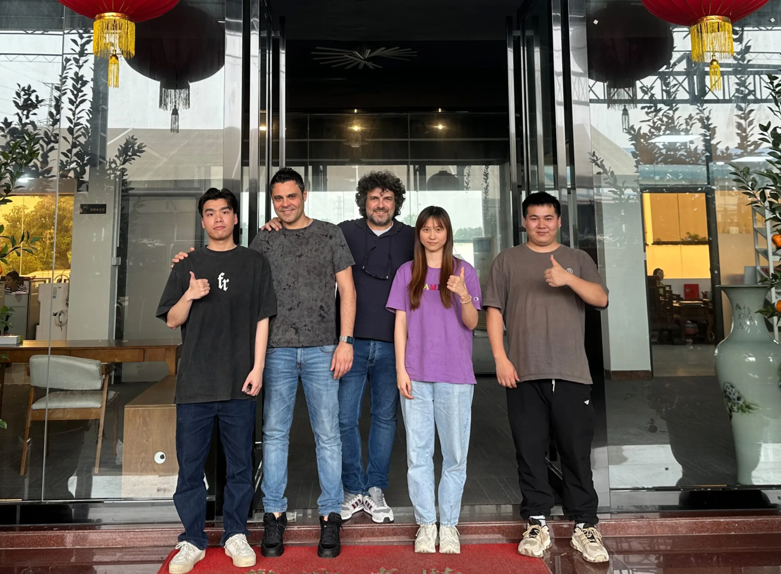 Progolas & Aprodoor taking photos with customers in front of the hotel